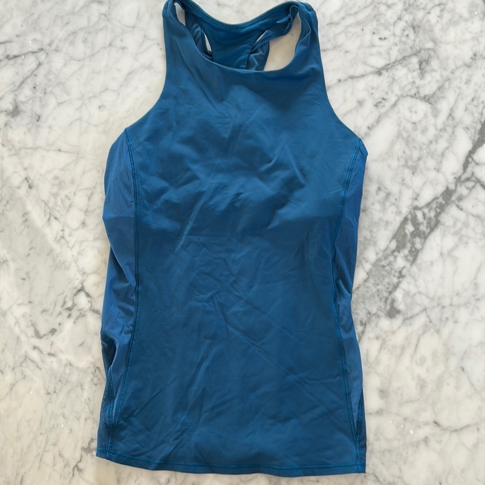 Size 8 Lululemon blue tank top. Gently worn, with built in bra.